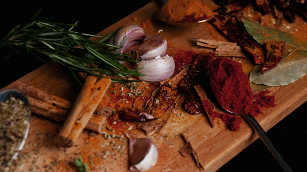 view of sliced red onions paprika and bay leaves
