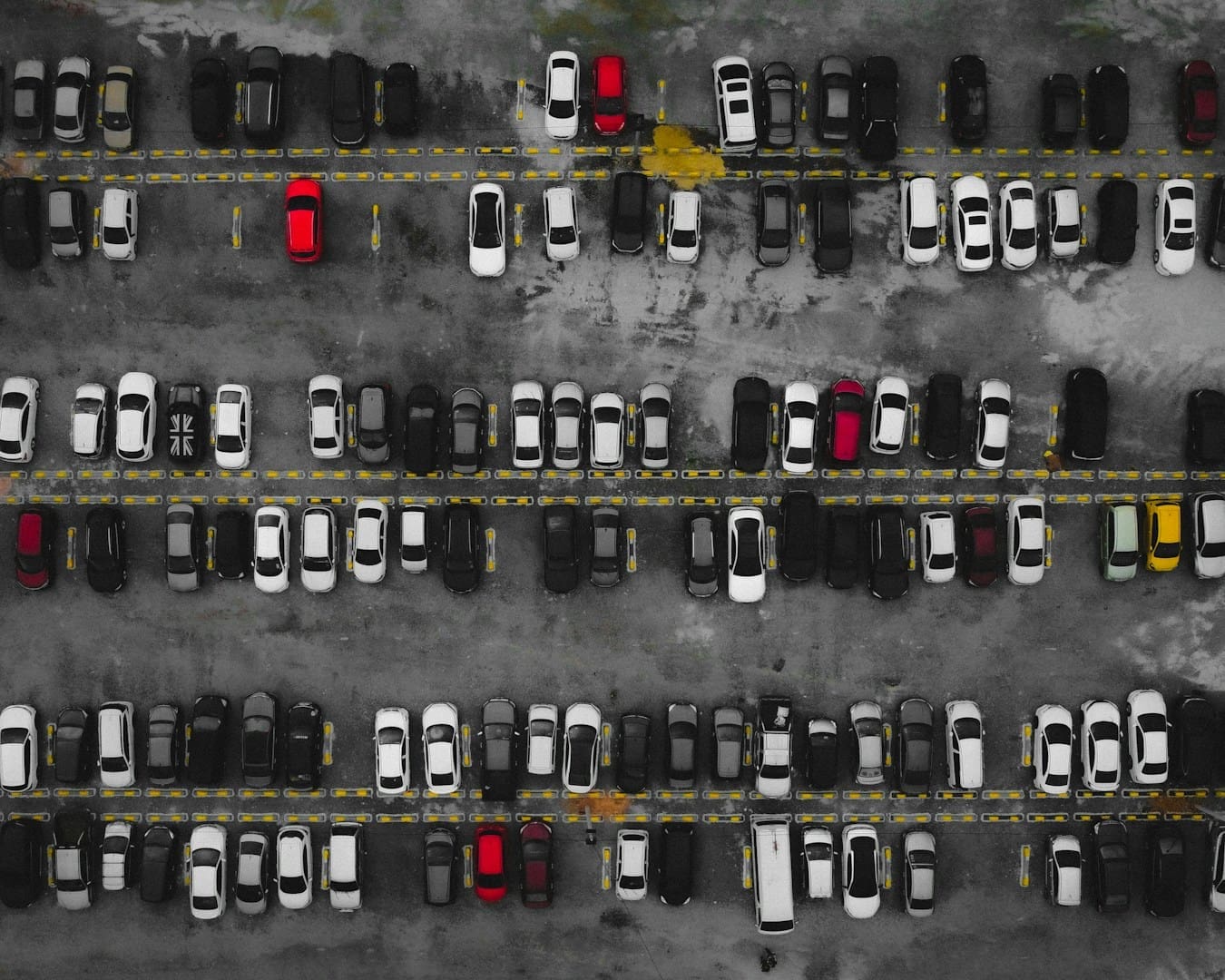 a parking lot filled with lots of parked cars