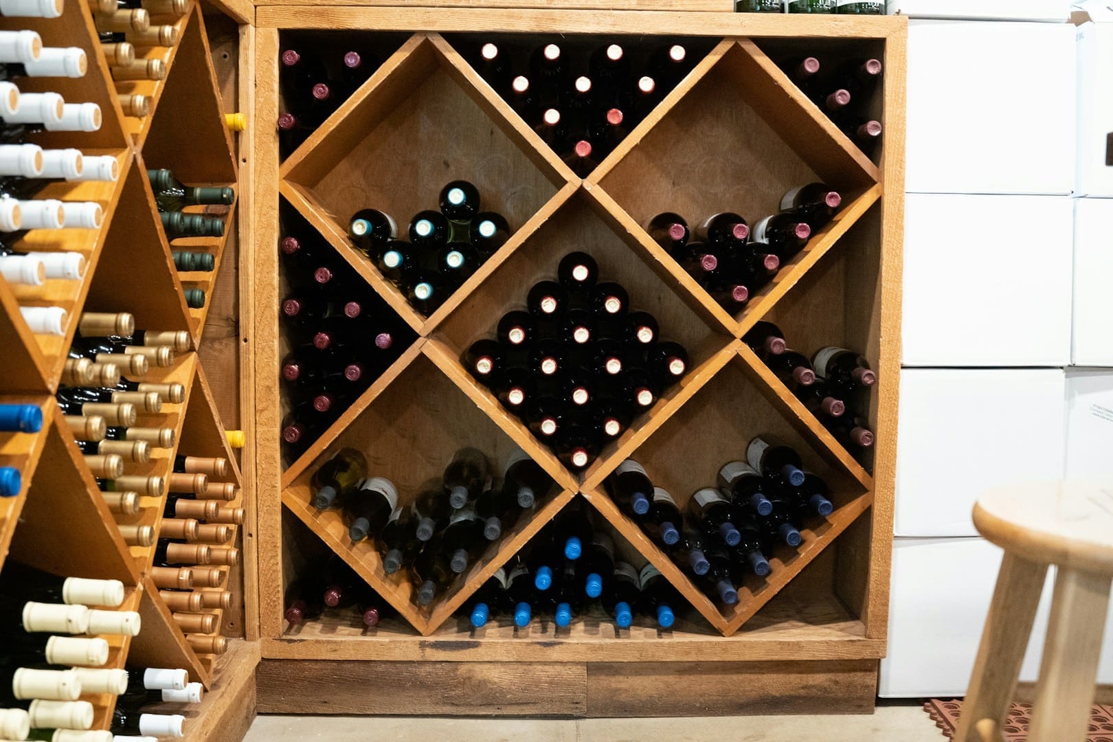 a wine rack filled with lots of bottles of wine